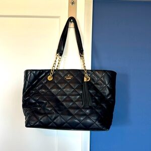 Kate spade tote purse, worn with slight stains on the inside and bottom of bag